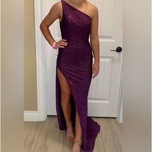 A one shoulder studded eggplant purple Sherri Hill Dress.